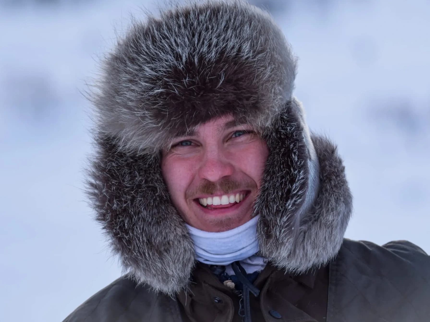 A guy with a traditional Lapland winter fur hat